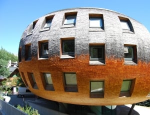 gray and brown 3 storey round concrete house thumbnail
