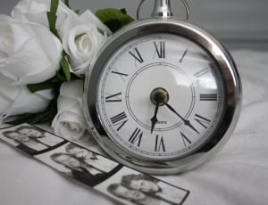 silver and white table analog clock thumbnail