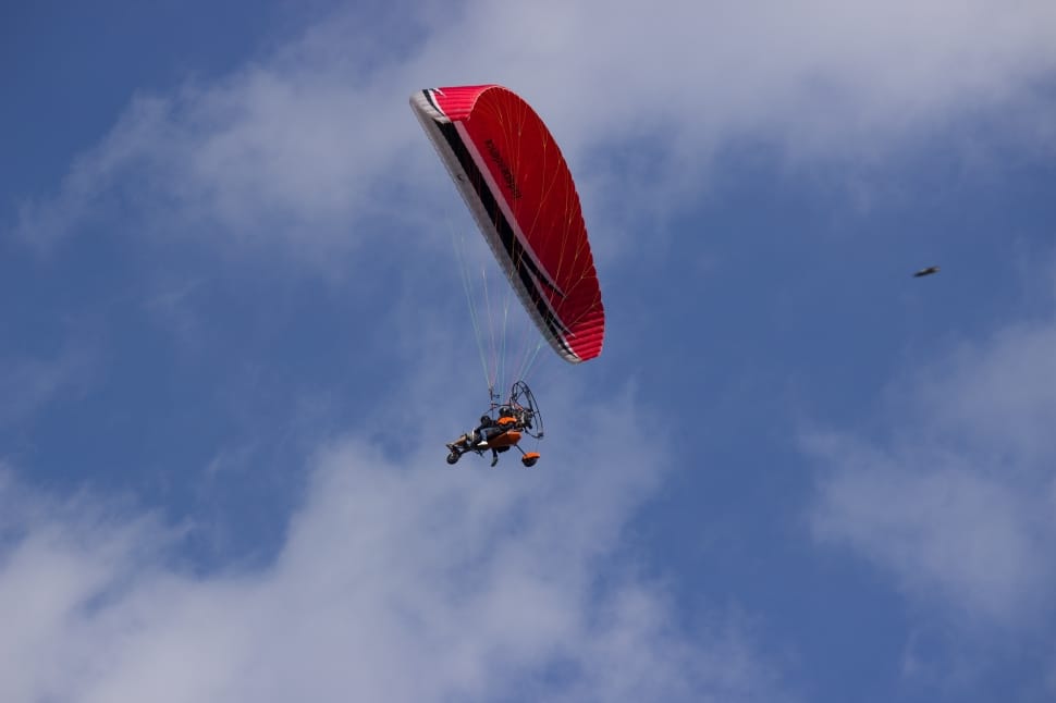 person paragliding at daytime preview