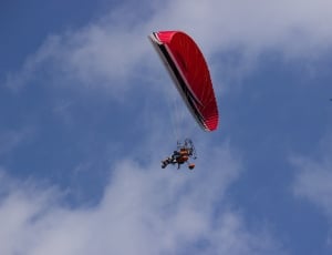 person paragliding at daytime thumbnail