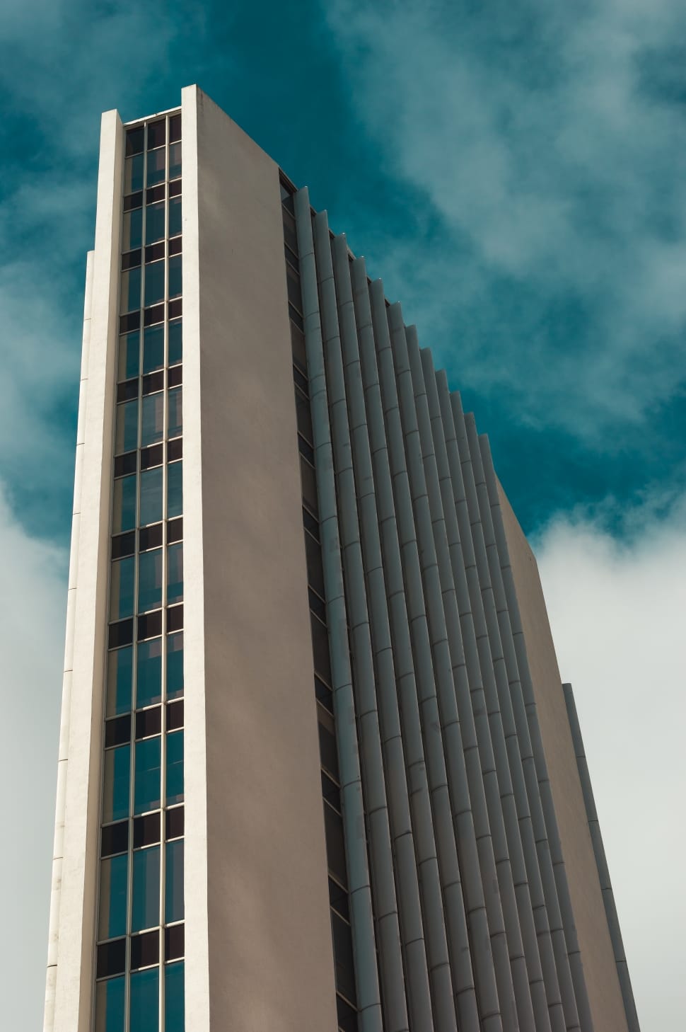 white and gray concrete building in low angle photography preview