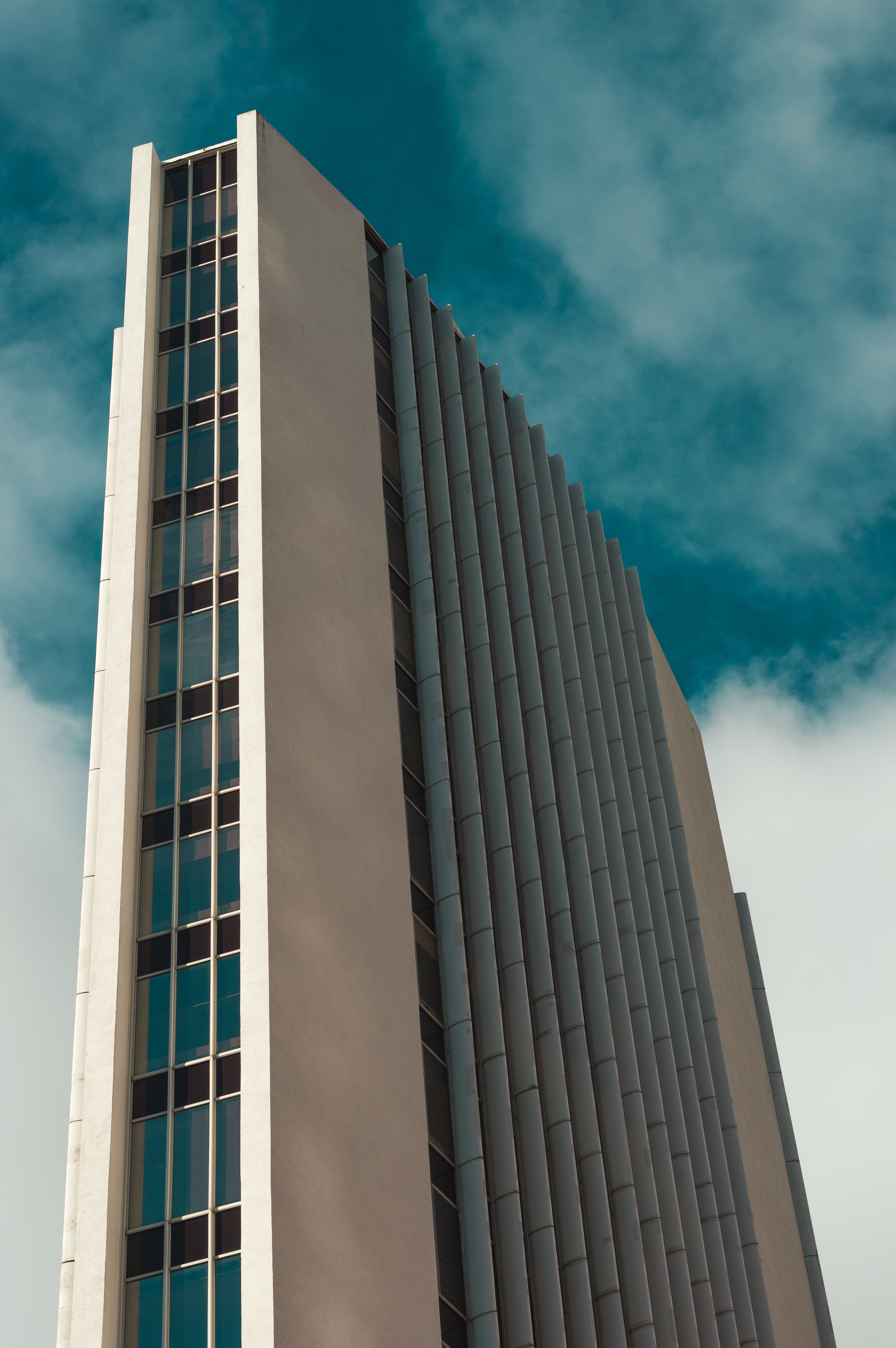 white and gray concrete building in low angle photography