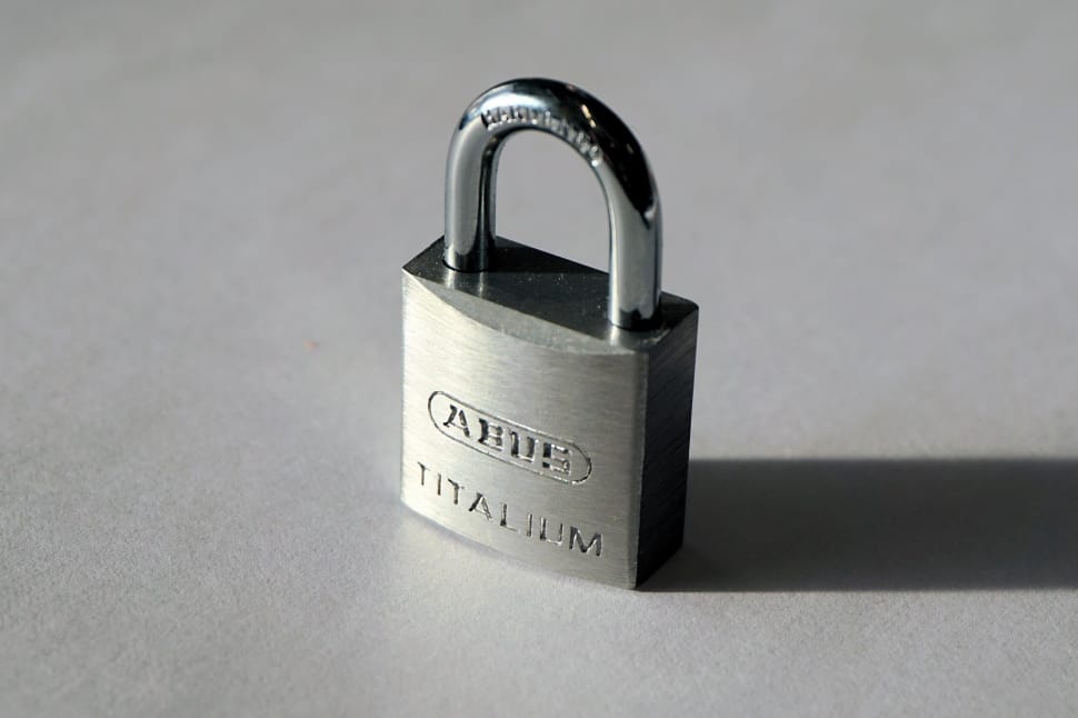 close photo of  Ahue padlock on gray surface preview