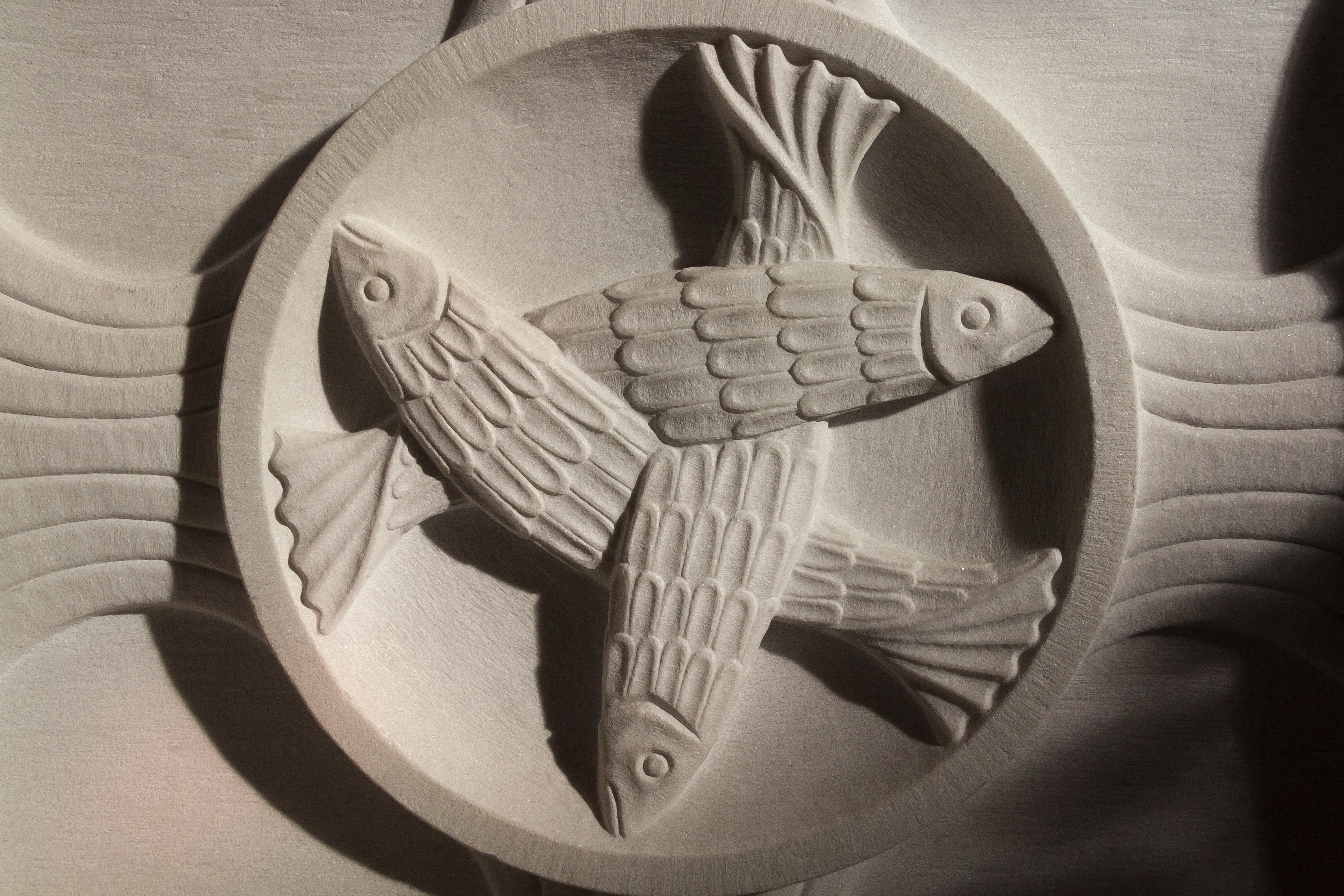 gray concrete fishes design carved decor