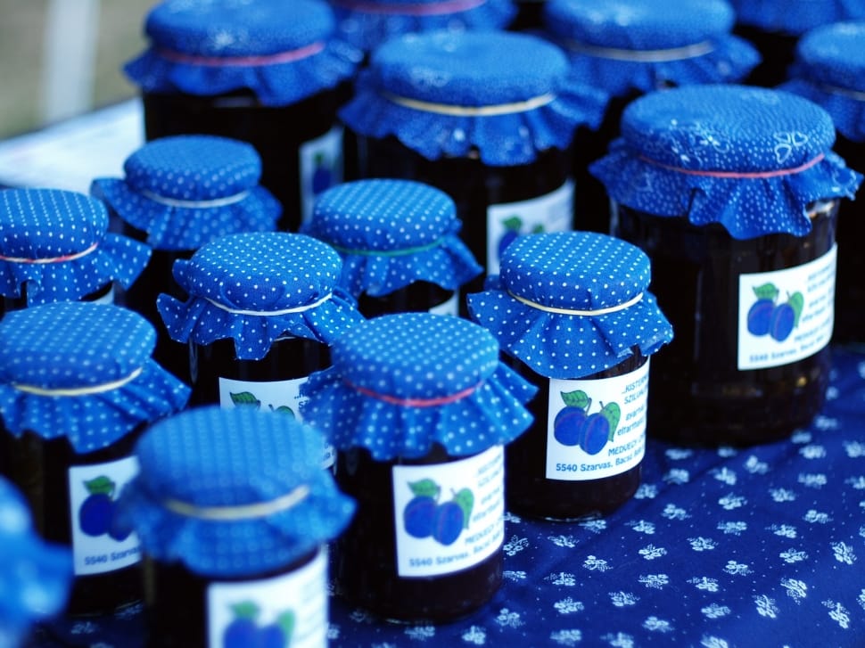 black glass bottle with blue cover preview