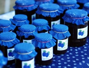 black glass bottle with blue cover thumbnail