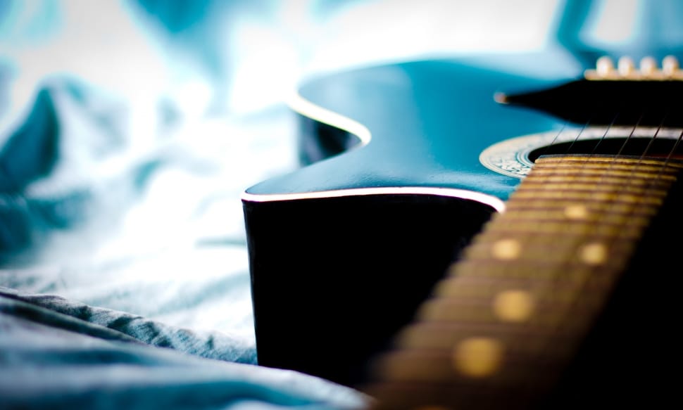 close up photography of black and brown acoustic guitar preview