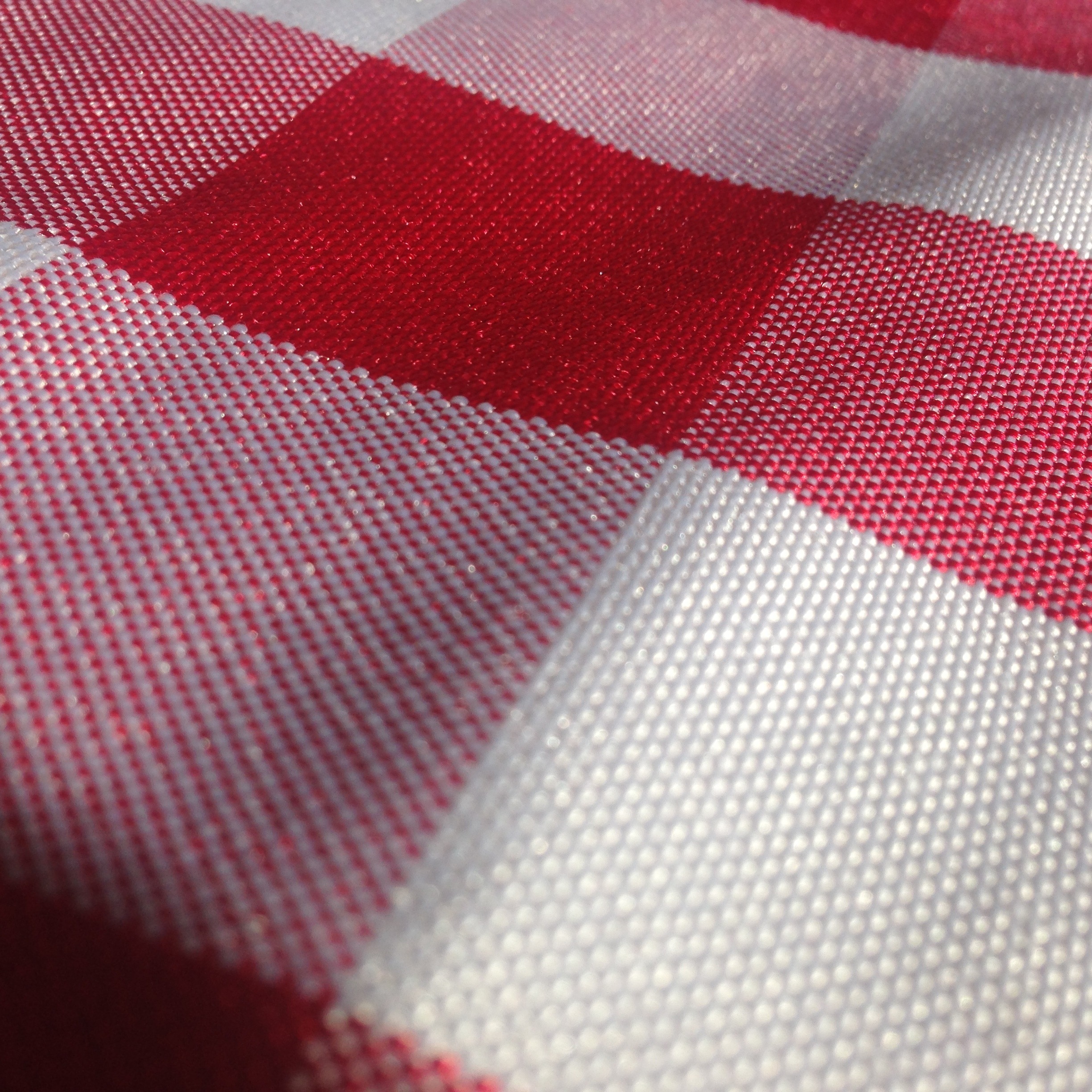 red and white gingham print textile