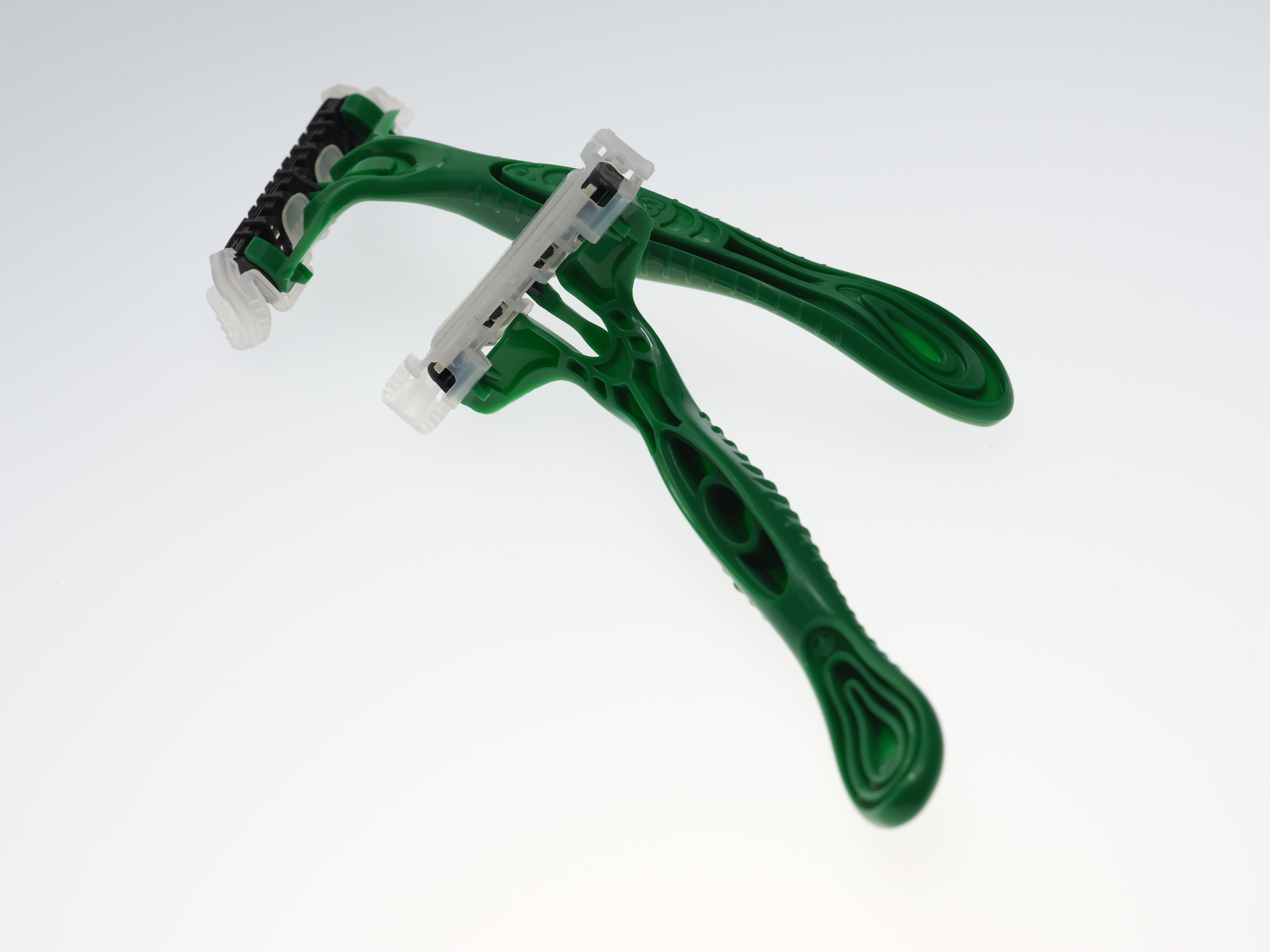 green and gray disposable shaving razor