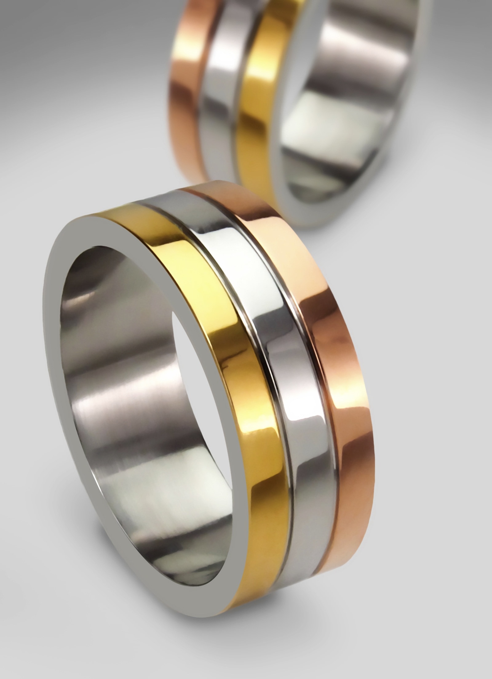 pair of gold silver and brown ring