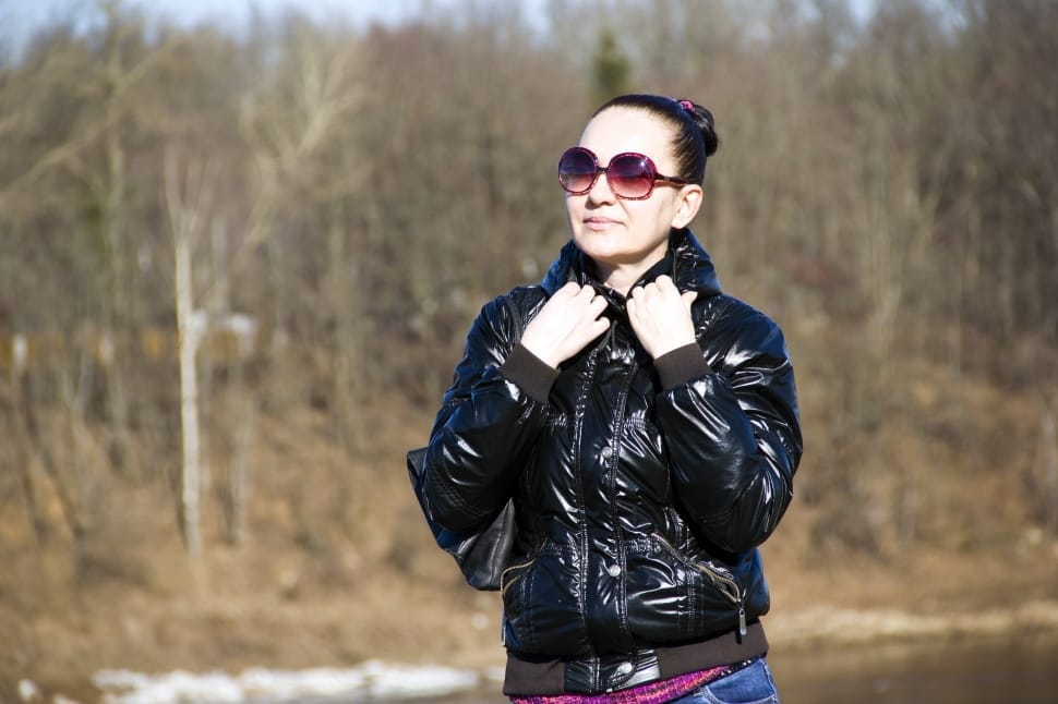 women's black leather jacket and blue jeans outfit preview