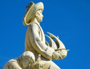 man holding ship statue thumbnail