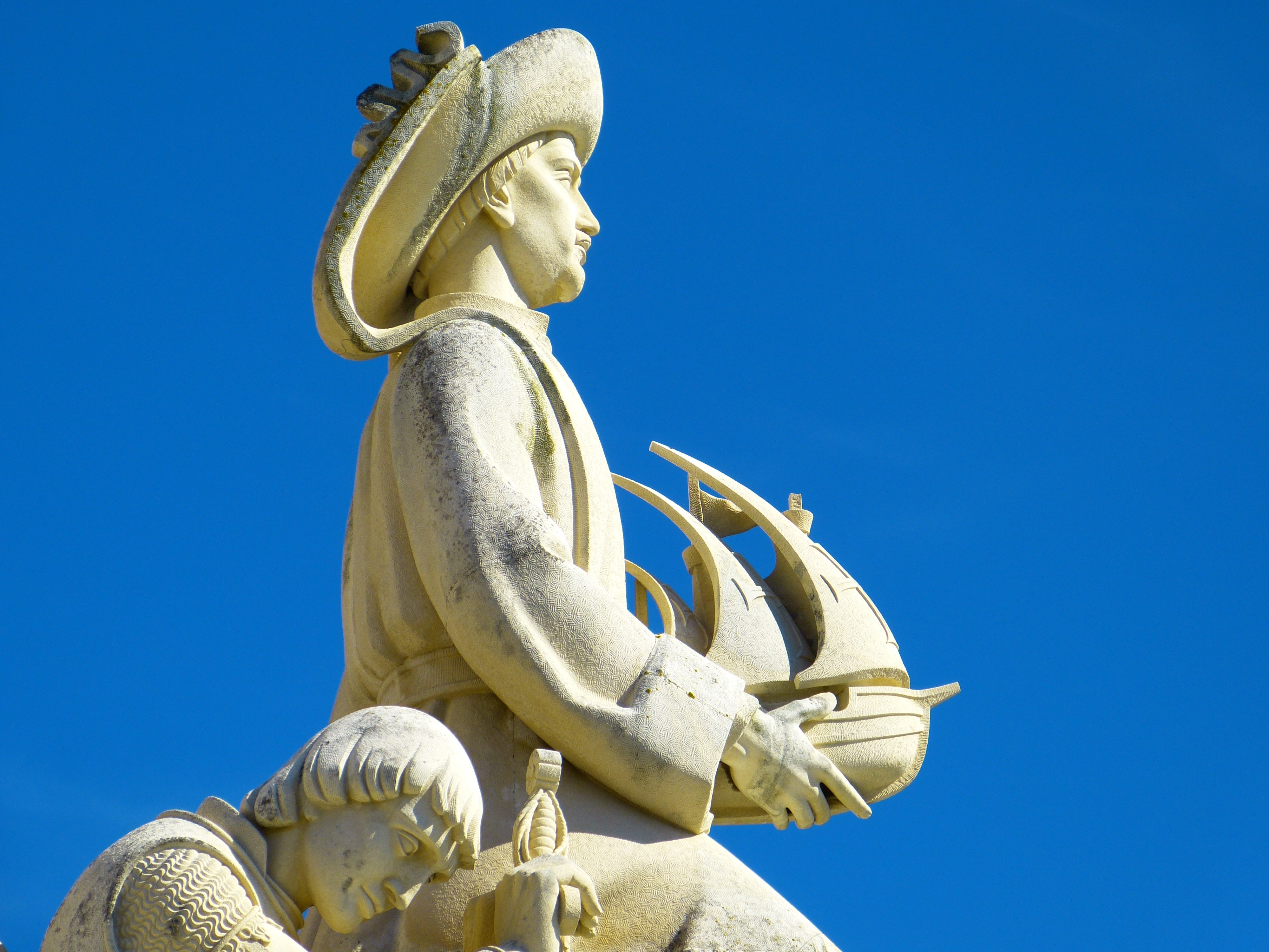 man holding ship statue