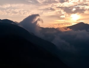 silhouette mountain during sunset thumbnail