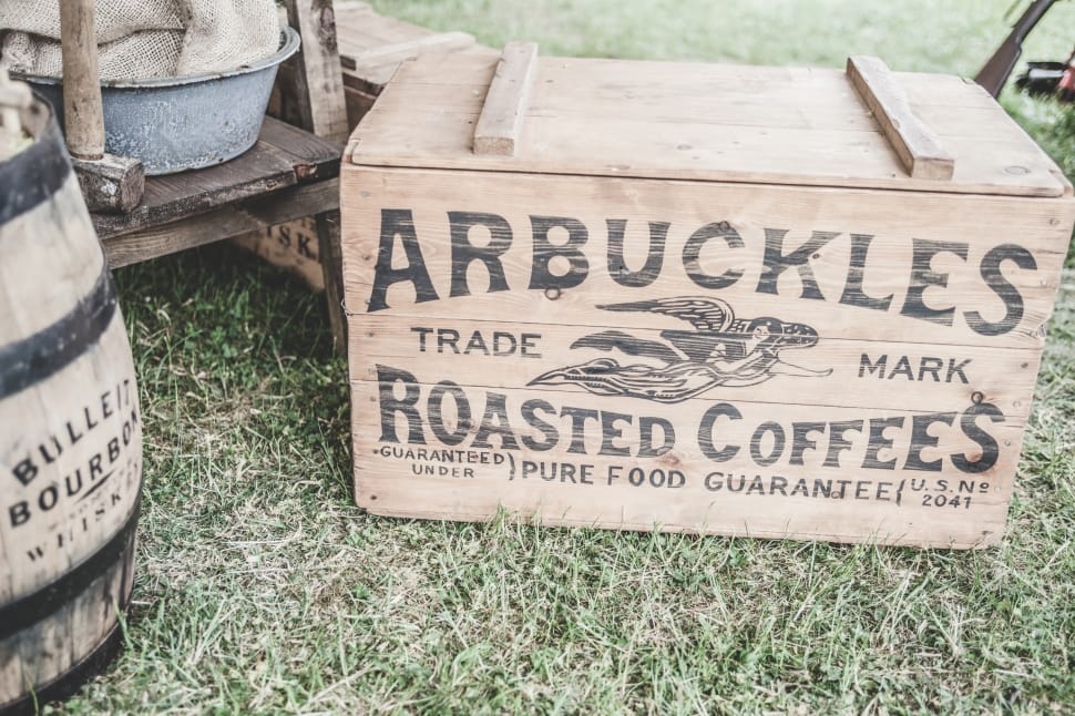 arbuckles trade mark roasted coffees box on green grass field preview