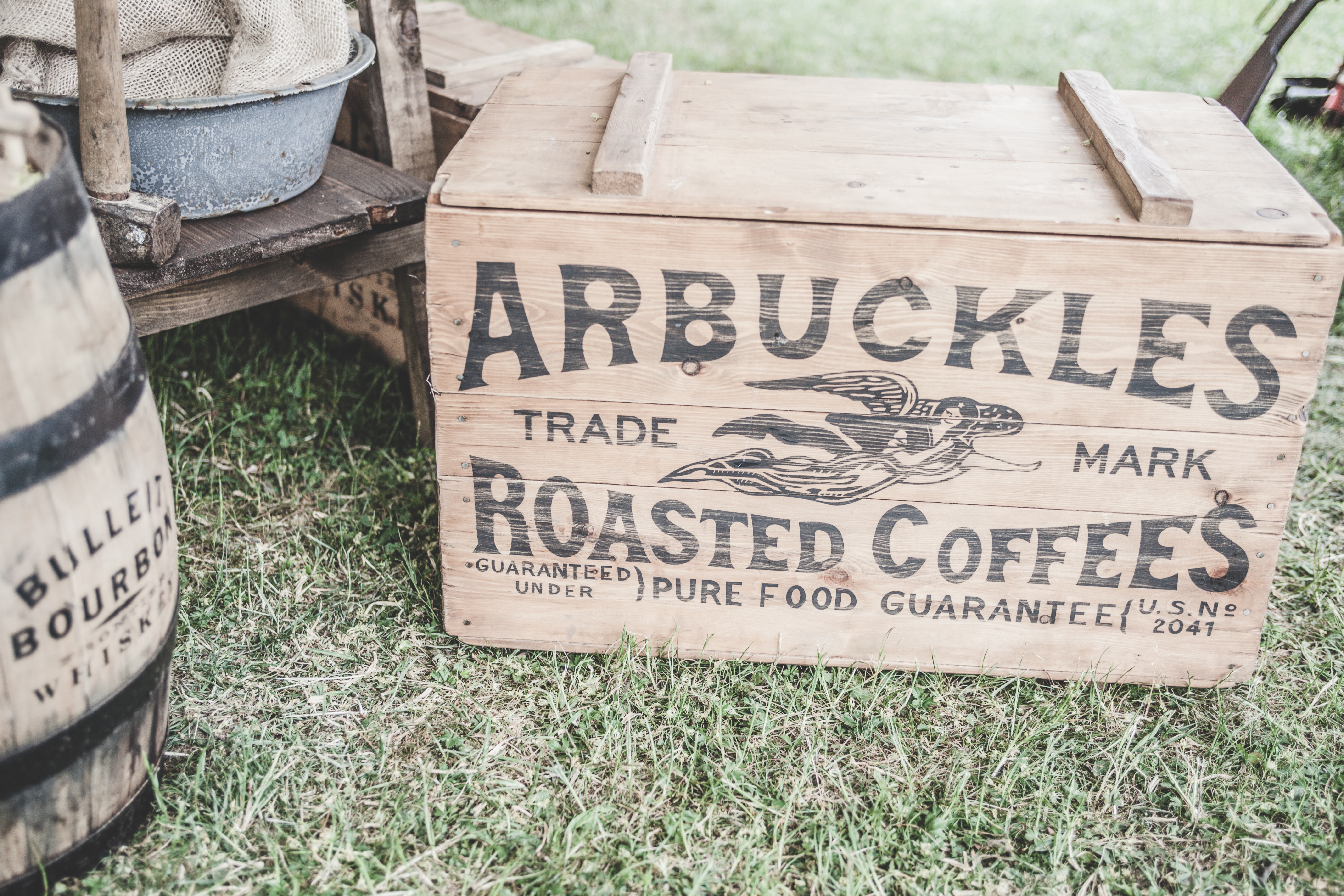 arbuckles trade mark roasted coffees box on green grass field