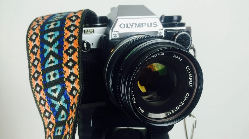 black and silver olympus dslr camera preview