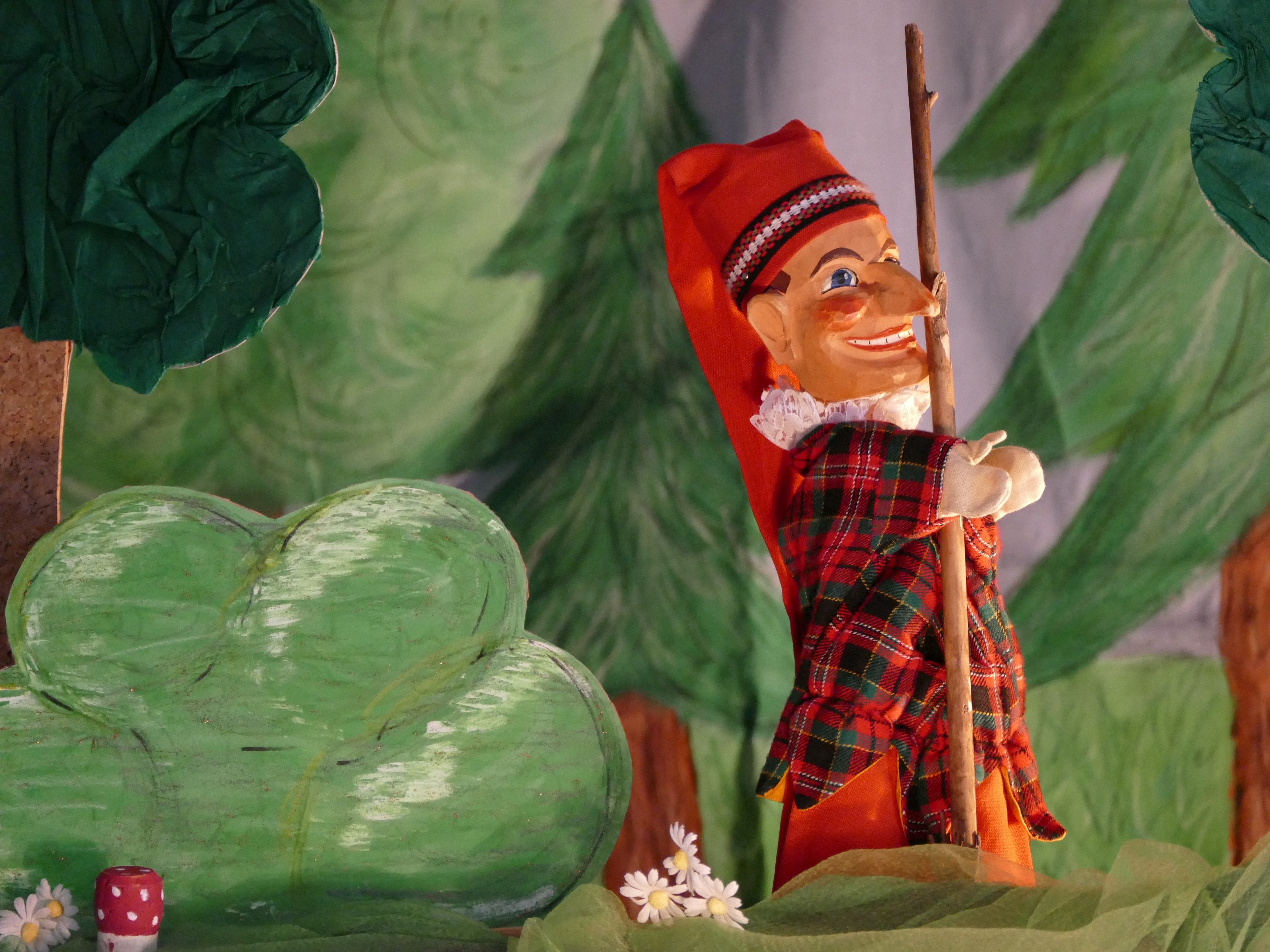 man wearing red hat figurine