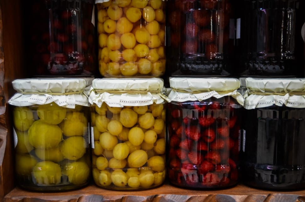 assorted round fruits on jars preview