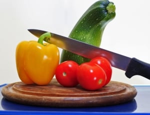 red tomatoes yellow bell pepper and kitchen knife thumbnail