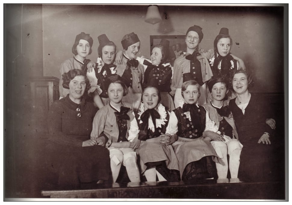 group of woman wearing black ribbon and hat photograph preview