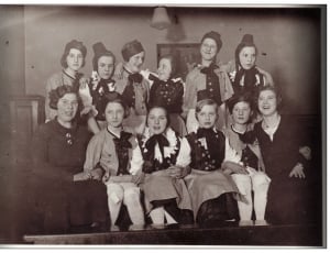 group of woman wearing black ribbon and hat photograph thumbnail