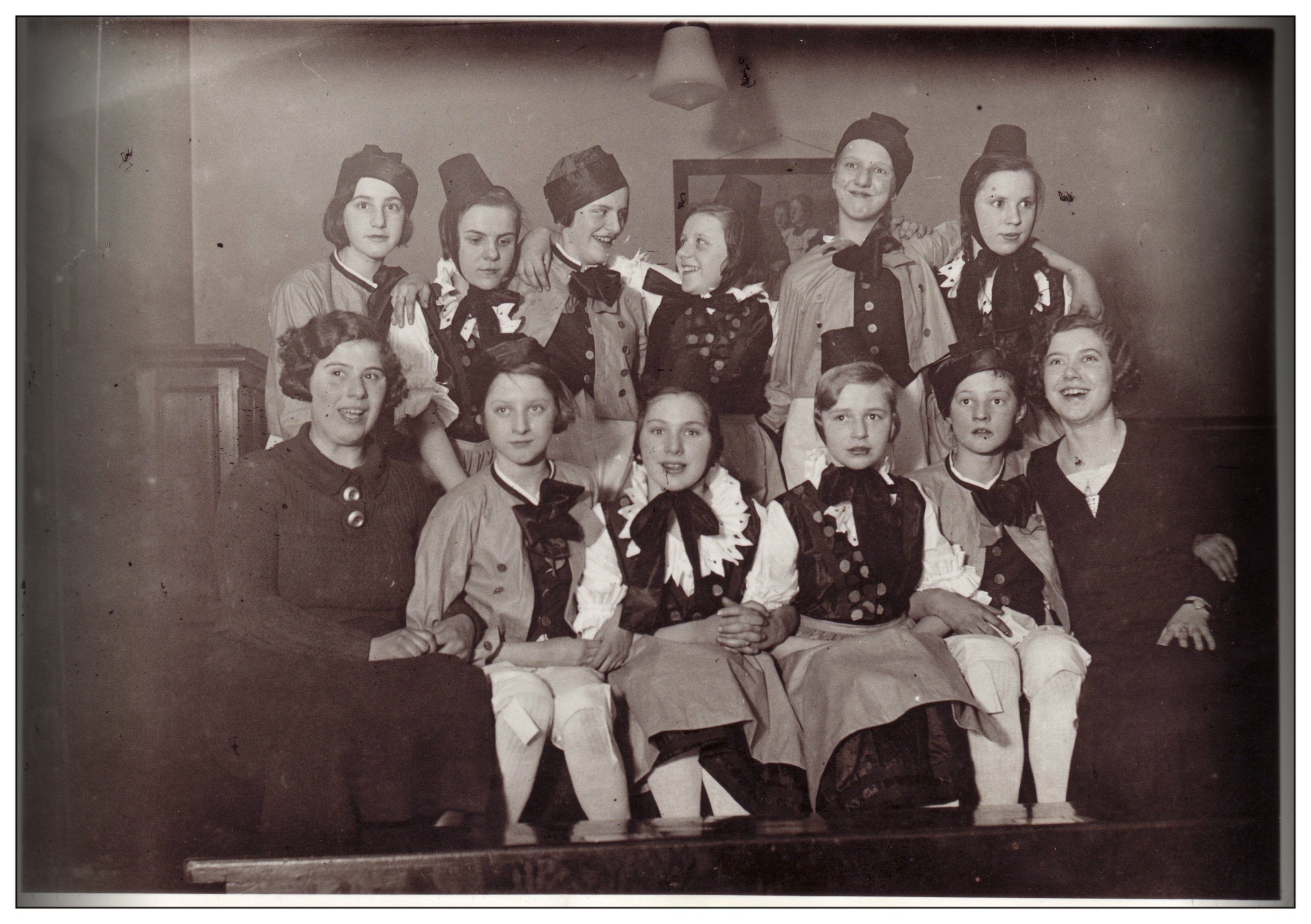 group of woman wearing black ribbon and hat photograph