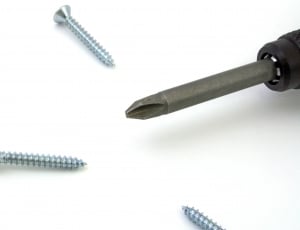 black power drill and gray metal screws thumbnail