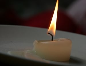 white lighted candle thumbnail