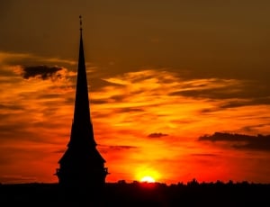 silhouette photograph of sunset in village thumbnail