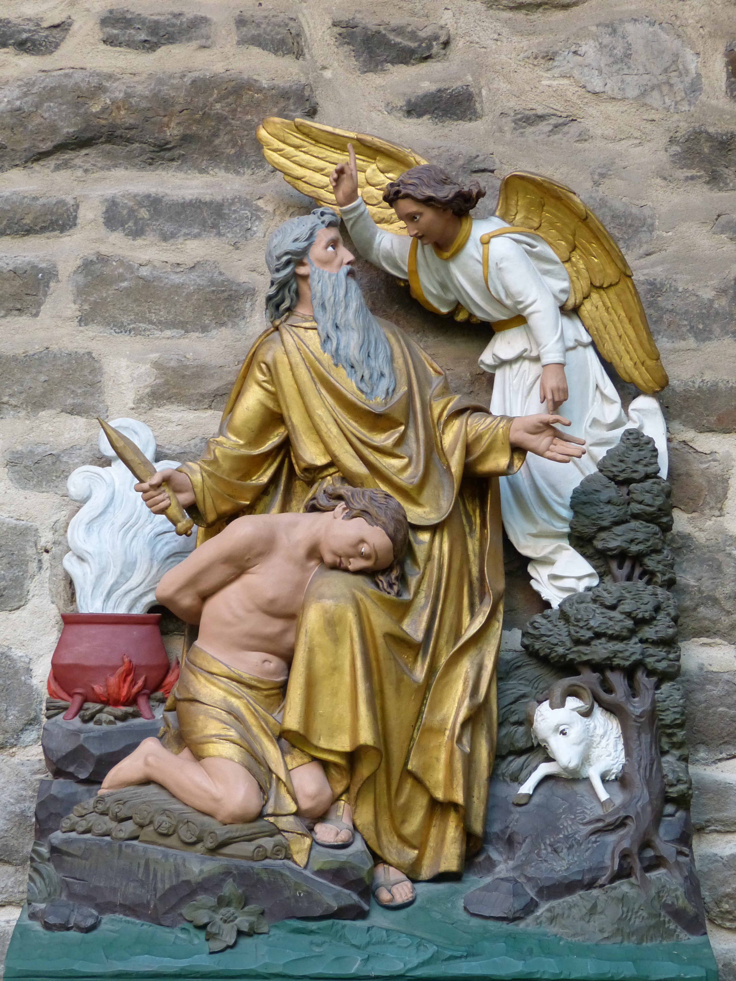 two religious men and angel figurines