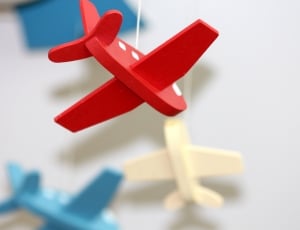 red wooden airplane toy thumbnail