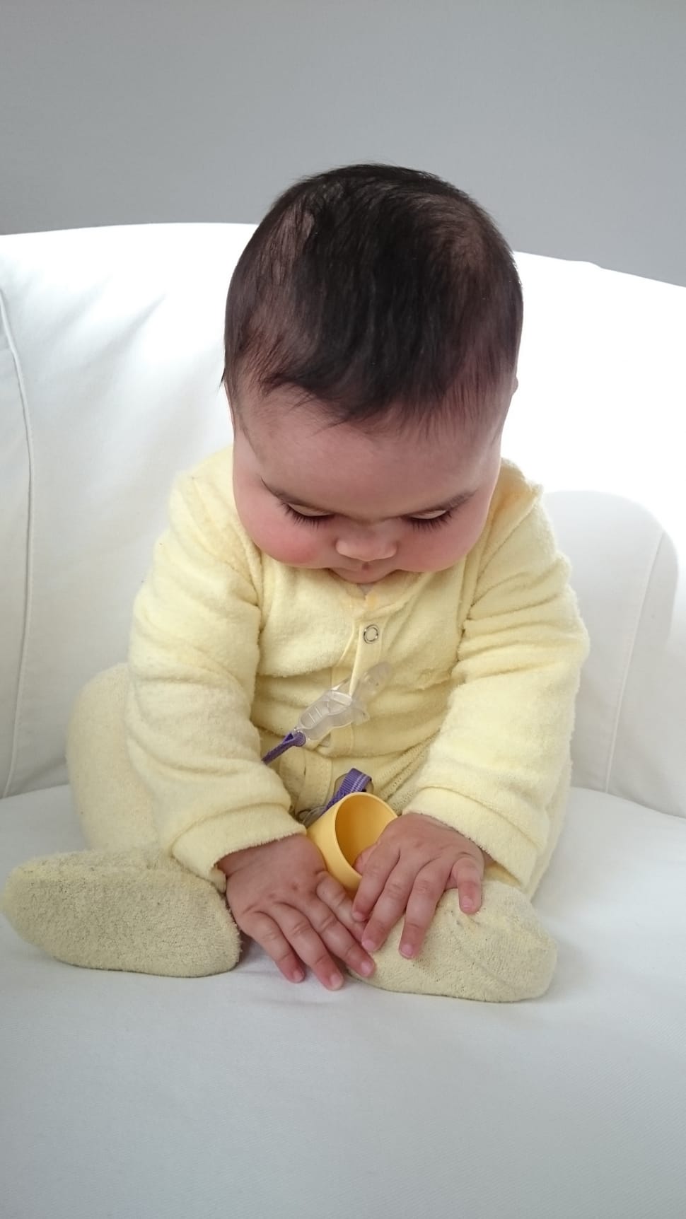 baby's yellow sleep suit preview