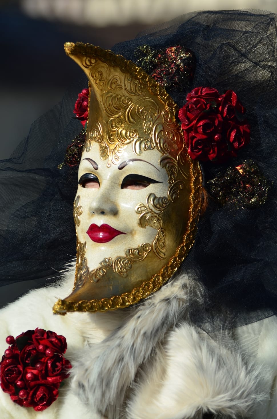 person wearing white and gold floral volto mask preview