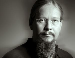 man with beard and glasses black and white photo thumbnail