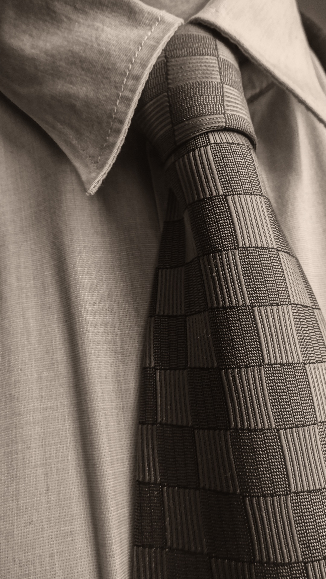 grey dress shirt and neck tie