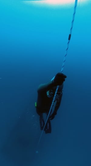 person holding white rope in body of water thumbnail