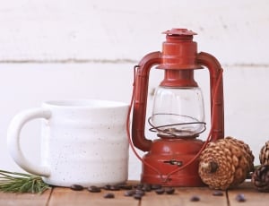 red kerosene lamp with white ceramic cup thumbnail