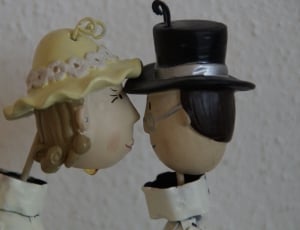 woman in white dress and man in white shirt figurine thumbnail