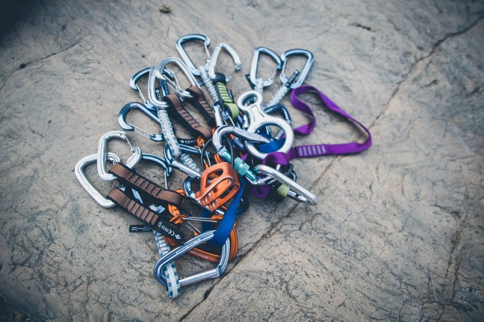grey metal carabiner lot on brown surface preview