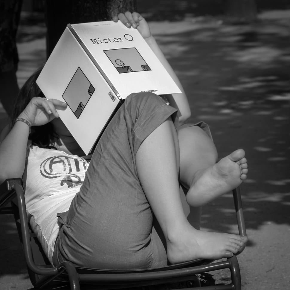 woman reading mister o book grayscale photo preview