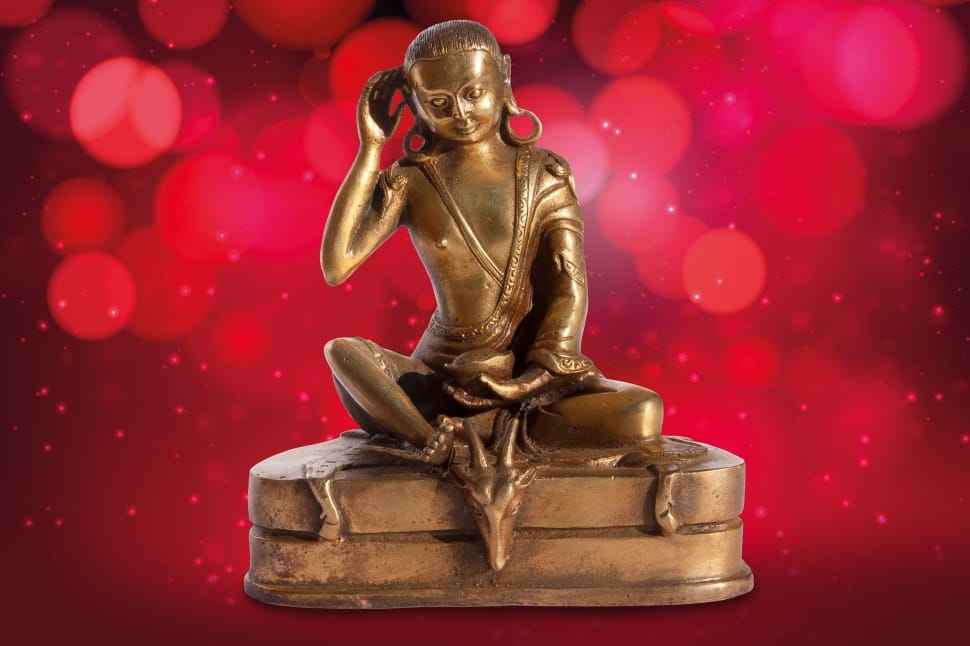 brass buddha sitting on dragon figurine preview