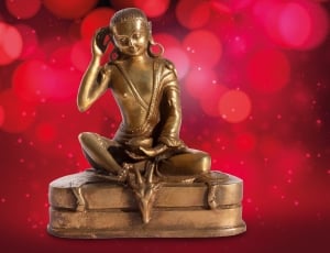 brass buddha sitting on dragon figurine thumbnail