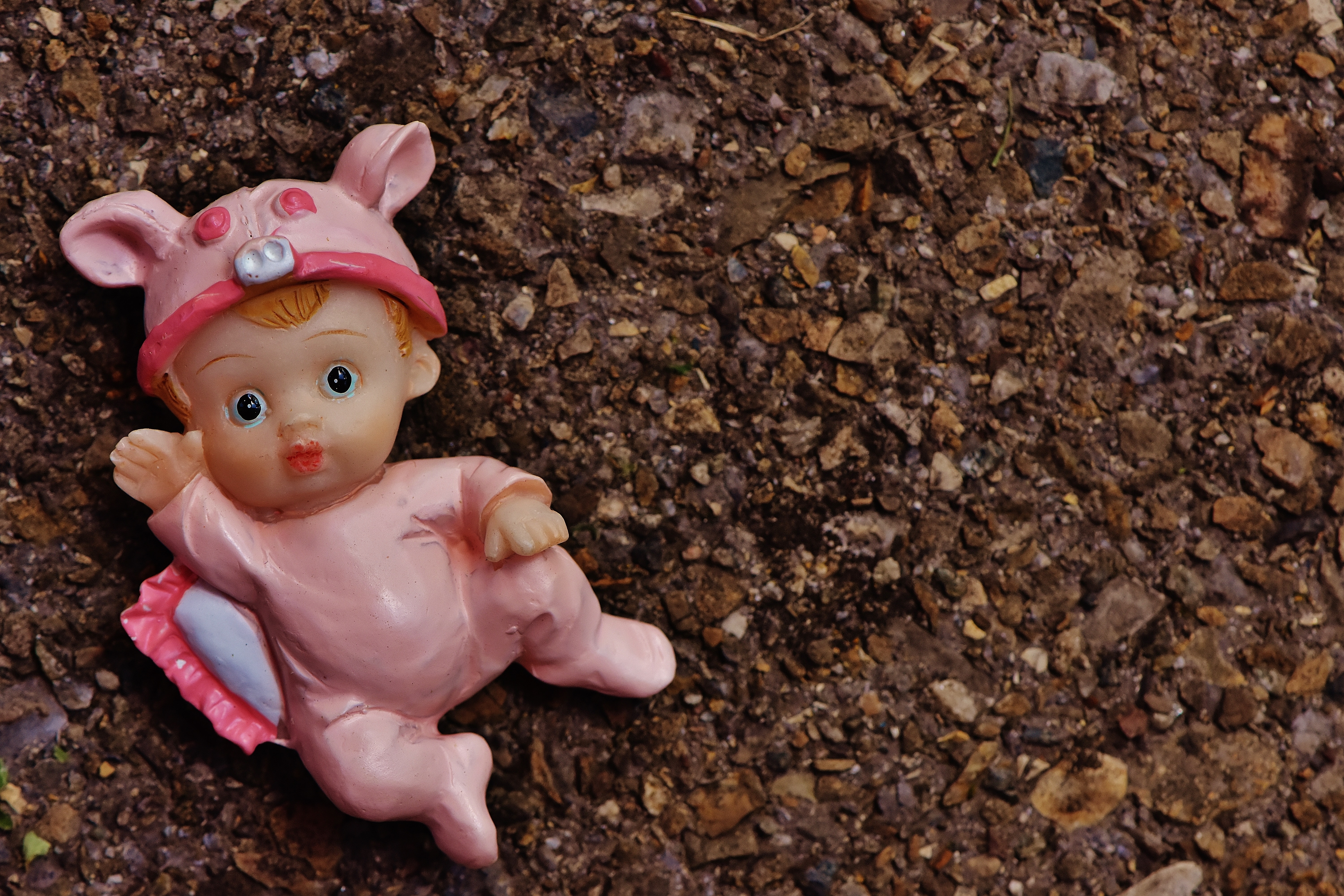 pink and brown baby figurine