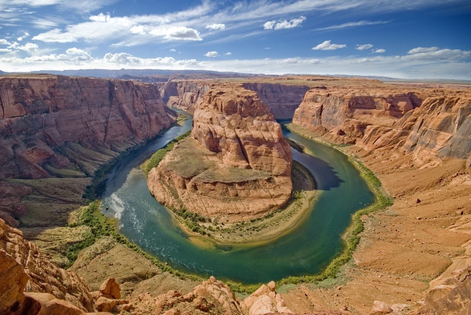 body of water surrounded by hills landmark free image | Peakpx