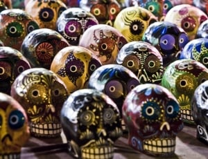 assorted multicolored skull figurines thumbnail