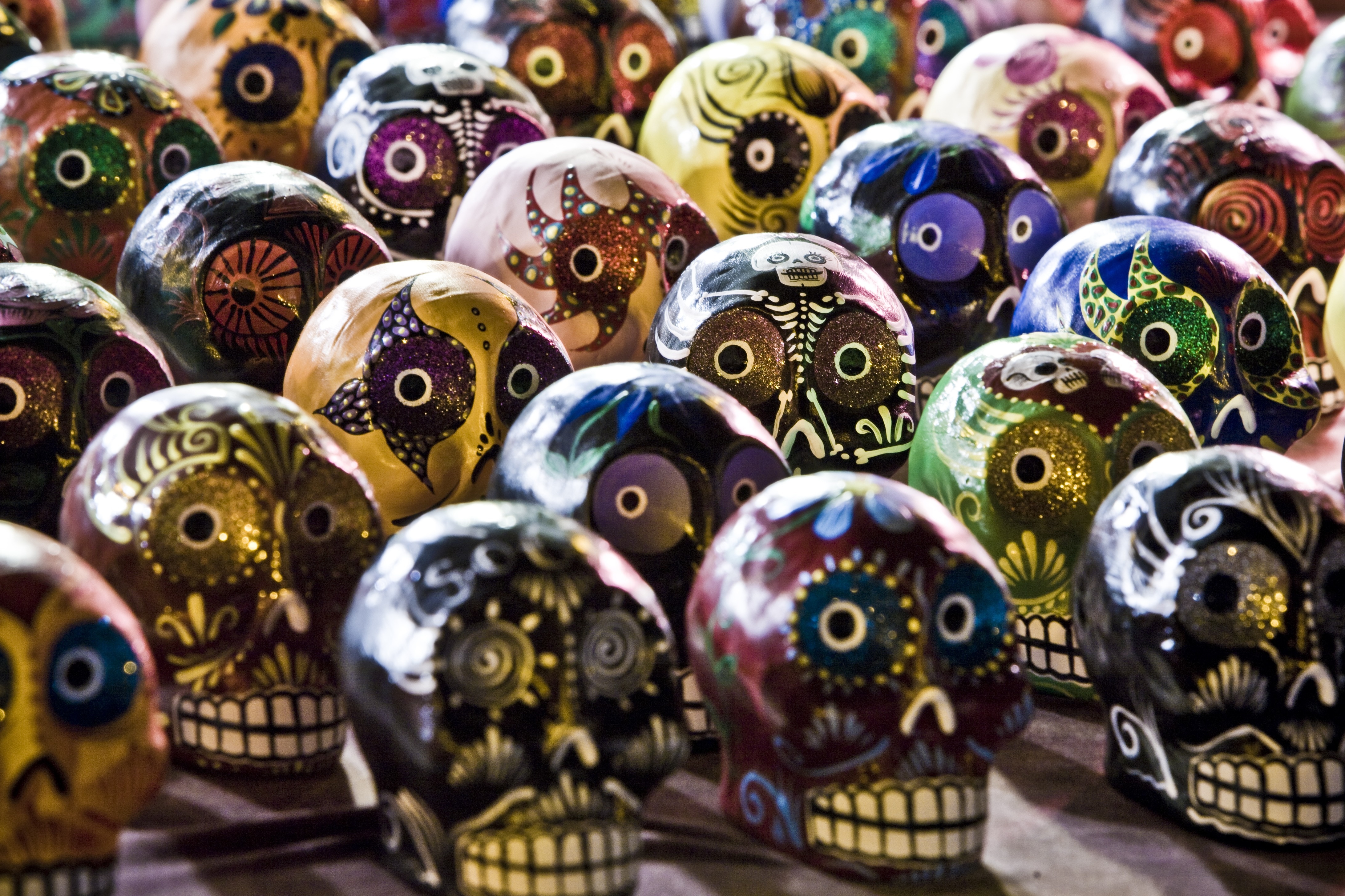 assorted multicolored skull figurines