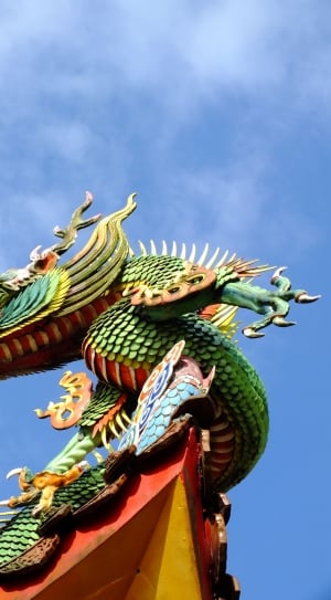 green orange and red dragon sculpture thumbnail
