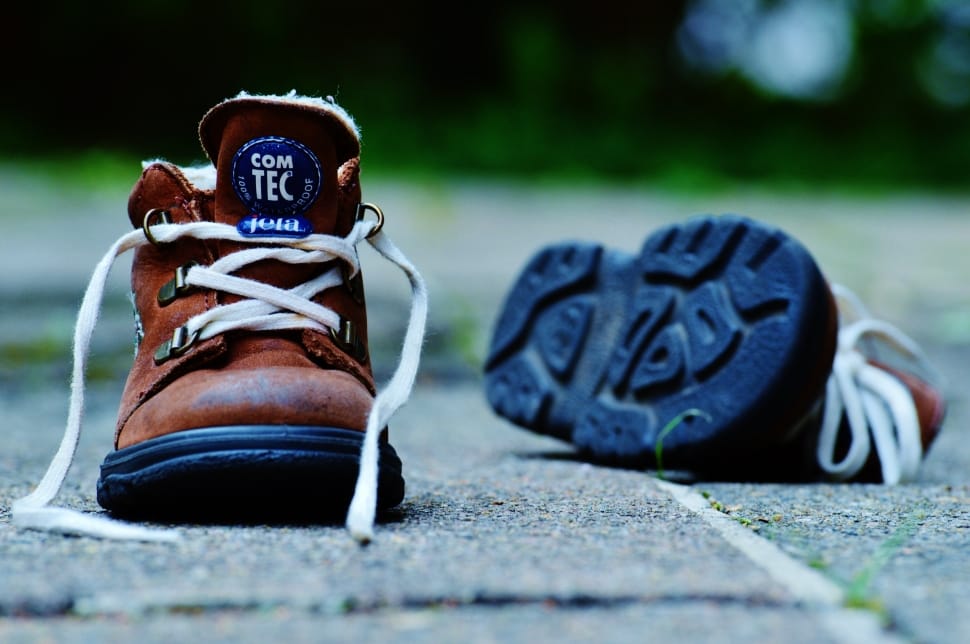 paired of brown and black lace com tec boots preview