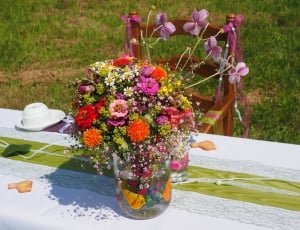 red-white-and-yellow petaled flower centerpiece thumbnail